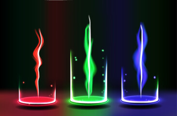 Three glass cylinders display vibrant light trails of red, green, and blue amidst a dark backdrop, creating an intriguing visual effect at night