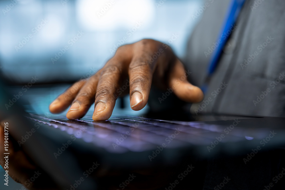 Poster admin in data center uses notebook to adjust power management settings, verifying compliance require