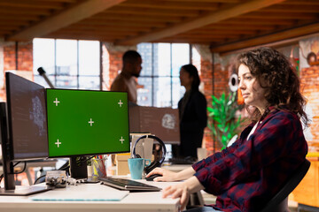 AI startup office software developer using green screen PC, implementing machine learning...
