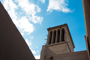 Historic windcatcher in Yazd, Iran, stands tall against a vivid blue sky—an iconic example of ancient Persian architecture and sustainable design.
