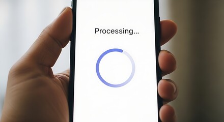 A hand holding a smartphone displaying a processing symbol on a white background screen view close up