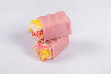 Modern pink candy. Angel Hair. Pink chocolate candy bar. With colored cotton candy. Light background. Close-up