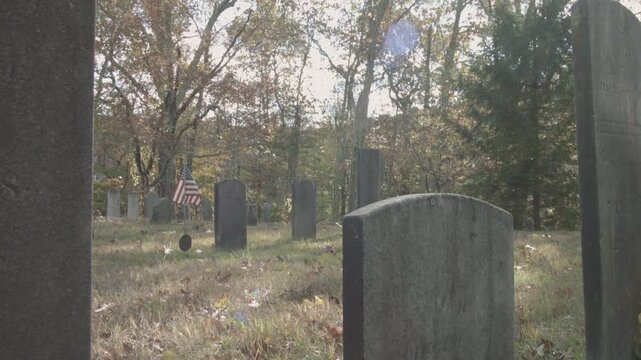 old headstones in rural cemetery in New England