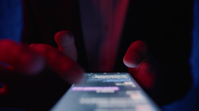 Closeup hands sliding smartphone display browsing message thread at night club