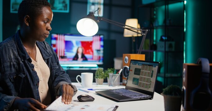 Broker investor employee checking stock exchange valuation financial profit numbers, doing calculations. Stockholder looking at market shares growth, comparing with notes on clipboard, camera B