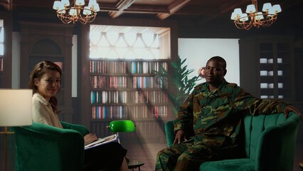 Portrait of war veteran meeting with a therapist to discuss about grief and distress due to PTSD...
