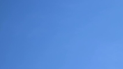Timelapse blue sky with passing white clouds. Fluffy cirrus clouds moving. Nature background. Time lapse 4k footage. - Powered by Adobe