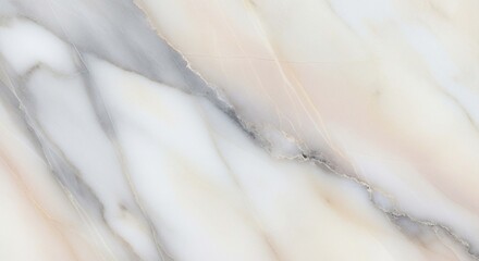 Close-up view of a light beige and gray marble surface, showcasing flowing veining patterns.