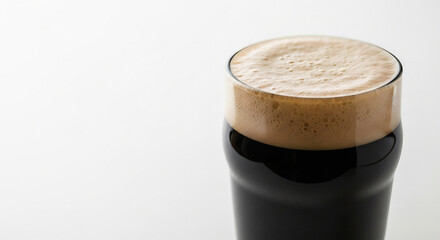 Glass of Dark Stout Beer with a Creamy Head
