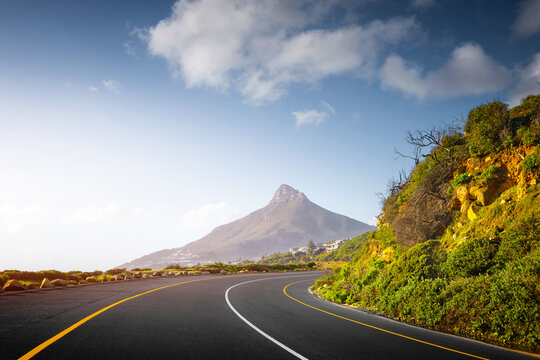 Scenic Coastal Road through Cape Town Suburbs with Mountains and Ocean View