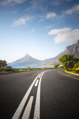 Scenic Coastal Road through Cape Town Suburbs with Mountains and Ocean View