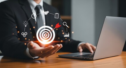 Businessman holding glowing target icon, symbolizing business strategy, goal achievement, and success with digital technology.