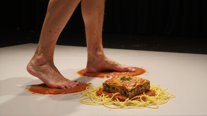 Bare Feet on Tomato Sauce with Pasta and Lasagna