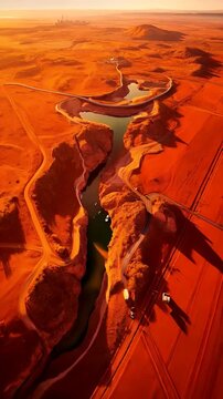 Aerial View of Winding Roads and River Through Mountain Landscape at Twilight
