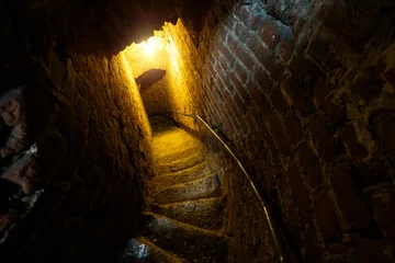 Acrylglasbilder Treppen Red brick narrow arched passage with spiral stairs  © Mulderphoto