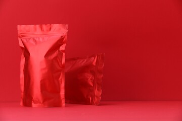 Zipper stand-up pouches on red background. Mockup for design