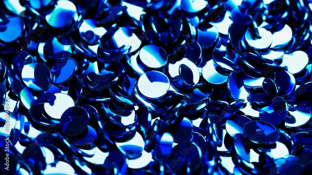 Wall mural shimmering blue sequin wave: dynamic light and color movement in closeup