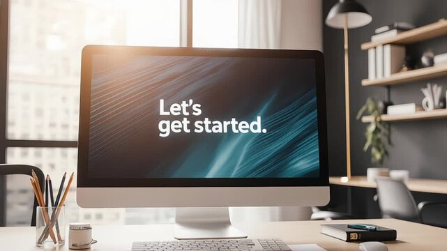 Computer monitor displaying Let's get started on a modern office desk