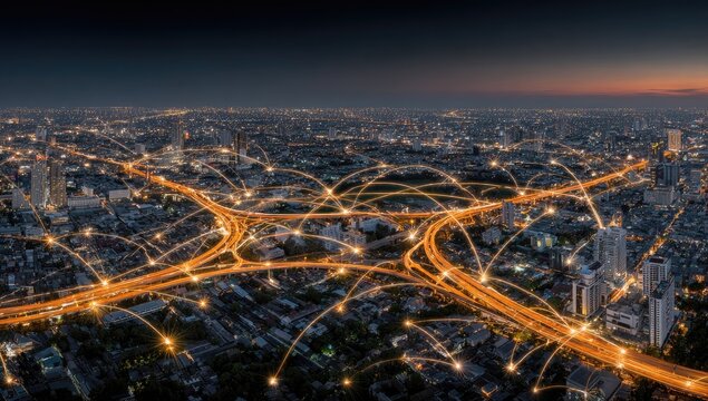 City network at night.  Aerial view of interconnected highways and city lights