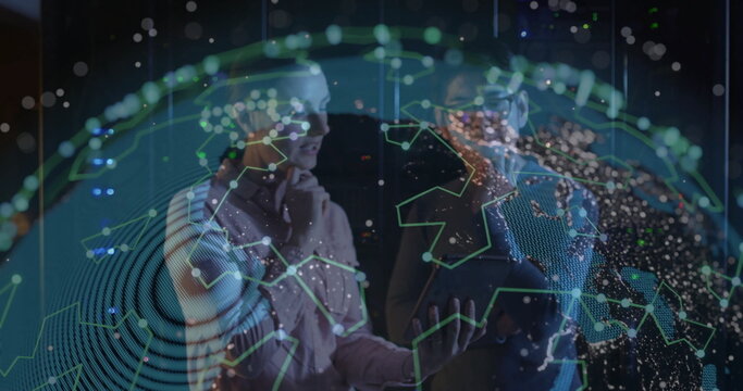 IT professionals analyzing network hologram in data center room, with tablet and server racks