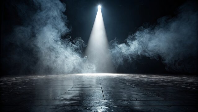 A single bright spotlight illuminates a smoky stage with a wet reflective floor