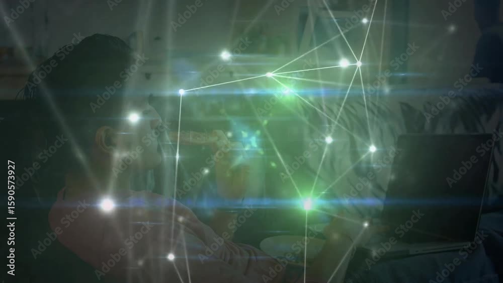 Poster man sipping mug and typing on laptop at home generating pulsing tech network overlay showing growth