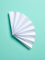 Origami Fan on Turquoise Background - Paper Art and Craft