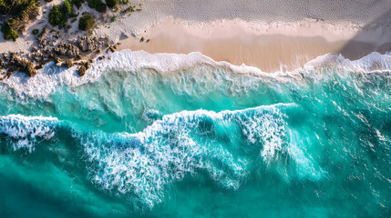 Aerial View of Turquoise Ocean Waves Crashing on a White Sand Beach
