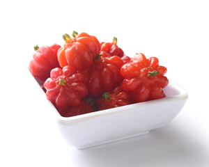 Portion of tropical pitanga fruit on a white background