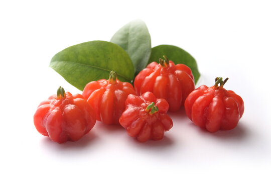 Portion of tropical pitanga fruit on a white background