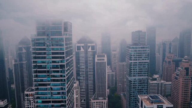 Cloudy urban skyline timelapse with highrise buildings in dense cityscape