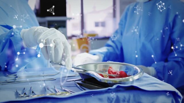 Surgeon grabbing forceps lifting specimen into kidney dish for biopsy with floating molecular data