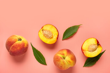 Sweet peaches and leaves on pink background