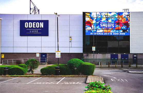 Odeon Luxe Cinema, Movie Theatre Sign, Parking Lot, Smurfs Animated Movie Promotional Poster, Animation Film Theatrical Release Banner, Acton, West London, UK - July 2025