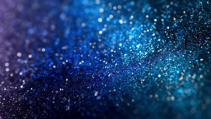 An abstract composition features a cascade of shimmering colors where vibrant blue and black hues meld together accentuated by scattered glitter particles. The focus is soft lending