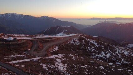 Aerial View of Ski Center in Chile with Bare Slopes and Dome Facility
