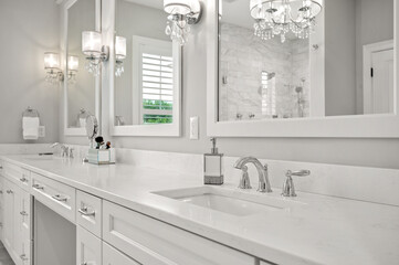 Beautiful White Bathroom with Stunning Countertop and Blue Sky View from the mirror
