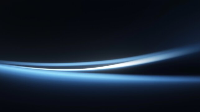 Minimalist abstract background featuring smooth blue light trails curving over a deep black gradient, creating a sleek, futuristic, and high-tech visual ideal for digital interfaces or design.
