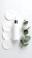 White lotion and cotton pads on marble