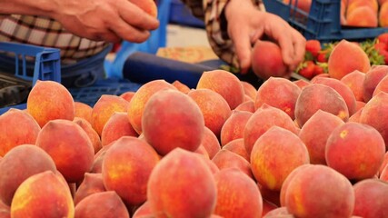 Fresh peaches at vibrant market showcasing local produce