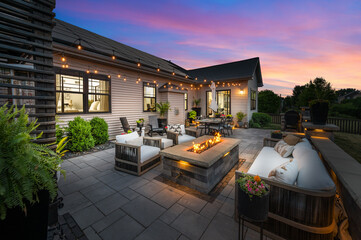 Twilight Patio Scene with Glowing Fire Pit and Hanging String Lights