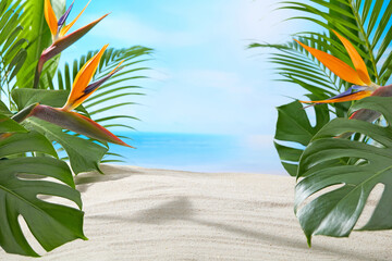 A bright and refreshing seaside setup with overlapping tropical leaves and blue ocean in the...