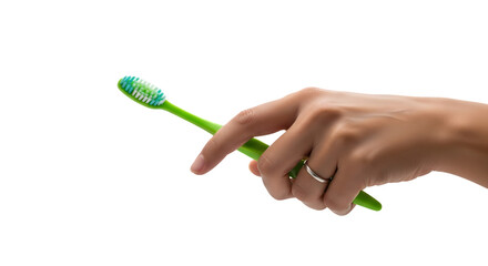 Hand holding a green toothbrush with blue and white bristles wearing a silver ring.