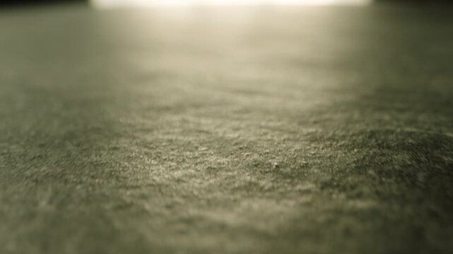 Camera moving on concrete floor in dark room with light . Gray empty surface  grunge style tile . Sunlight drop on cement wall or dirty grunge and rough floor of industrial construction building