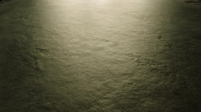 Three silicon nitride balls are rolling on the ceramic floor . Big medium and small heavy metallic or ceramic balls moving , knocking , hitting each other . Shot on ARRI ALEXA in Slow Motion