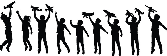 Silhouette of children playing with toy airplanes in joyful poses, childhood fun, imagination, outdoor activity