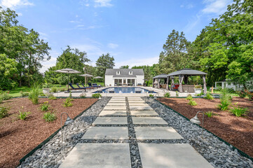 Fototapeta premium Luxury Backyard Pool with Modern Pool House and Lounge Area