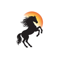 Rearing Black Horse Silhouette with Flowing Mane Against a Gradient Sunset