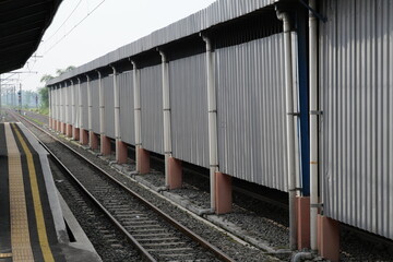 Perspective of the railway line at a simple station.