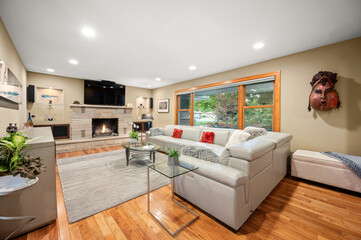 Cozy Living Room with Couch and TV Above Fireplace